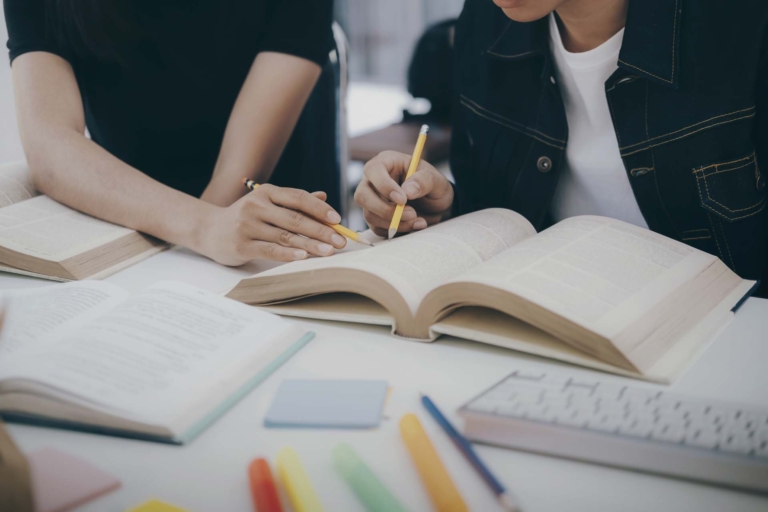 Young students campus helps friend catching up and learning